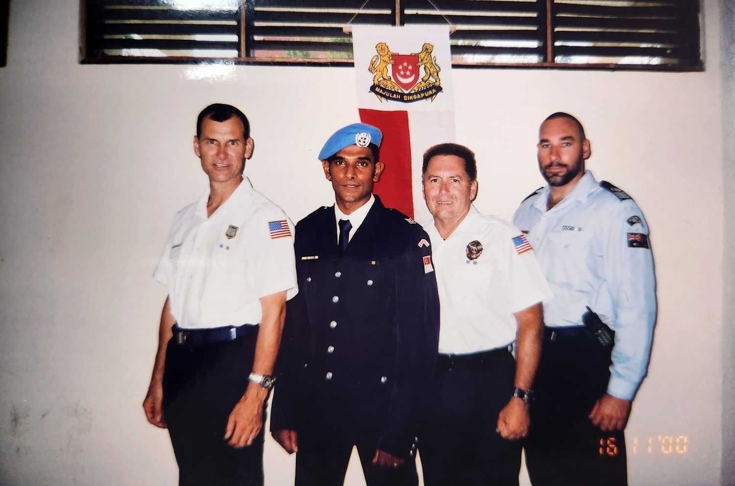 a young DSP Singh standing together with other foreign Police officers as part of the UNPKF team