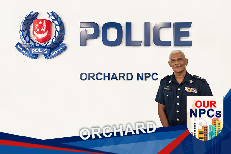 teaser image of the Orchard NPC signage and DSP Singh infront, with a custom designed banner at the bottom of the photo, stating "Orchard".