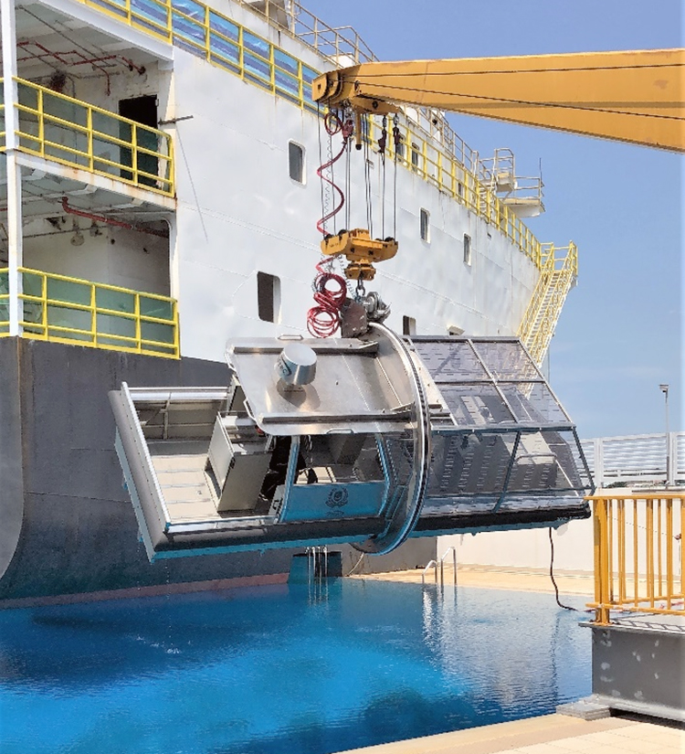 UET simulator being lifted up by a crane