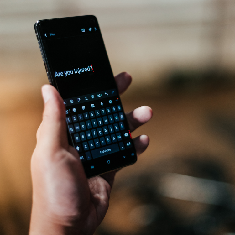 police officer checking mobile phone