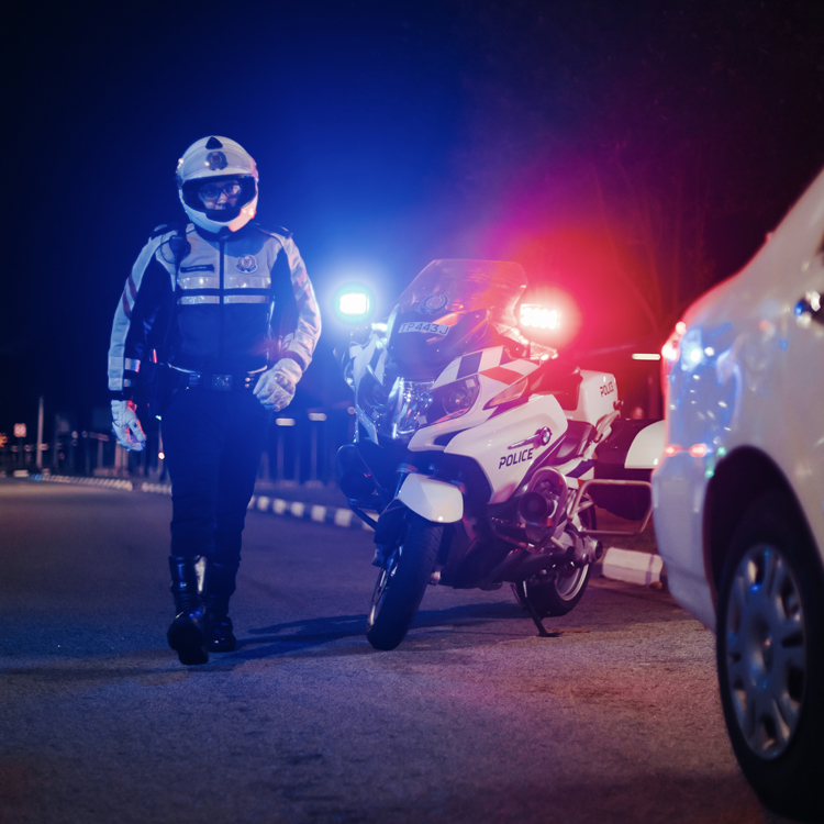 traffic police officer approaching car 