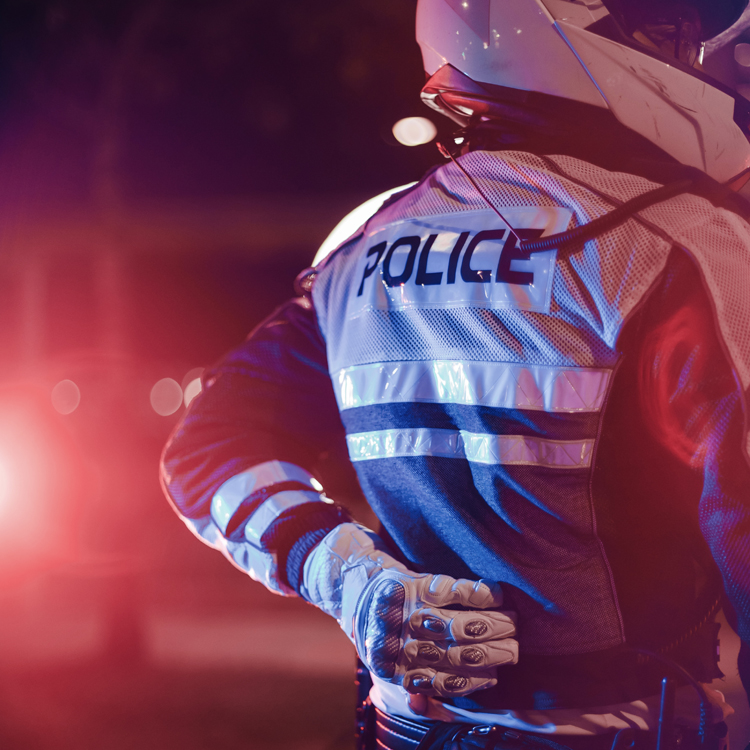 traffic police officer holding his back