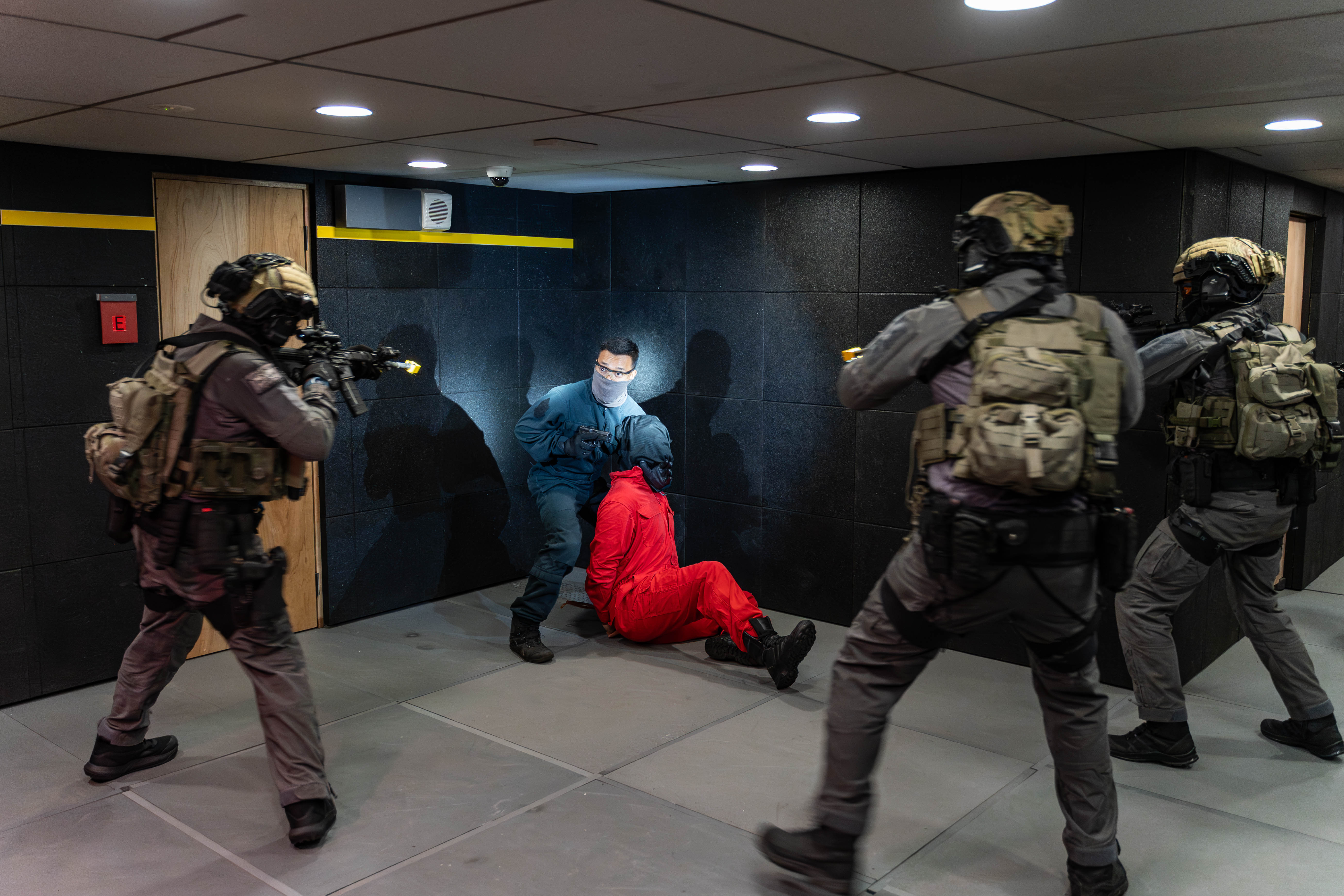 STS officers encircling a gunman before rescuing the hostage. PHOTO: Ryan Quek