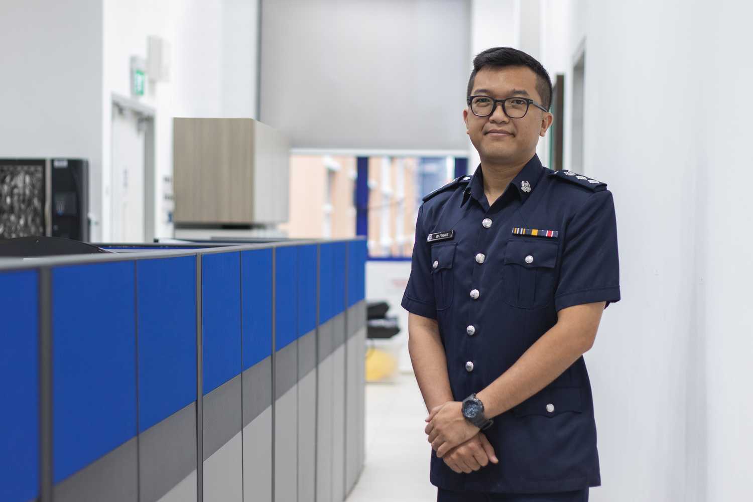 Supt Muhammad Firdaus enjoys the daily hustle and bustle of operations at Geylang NPC.