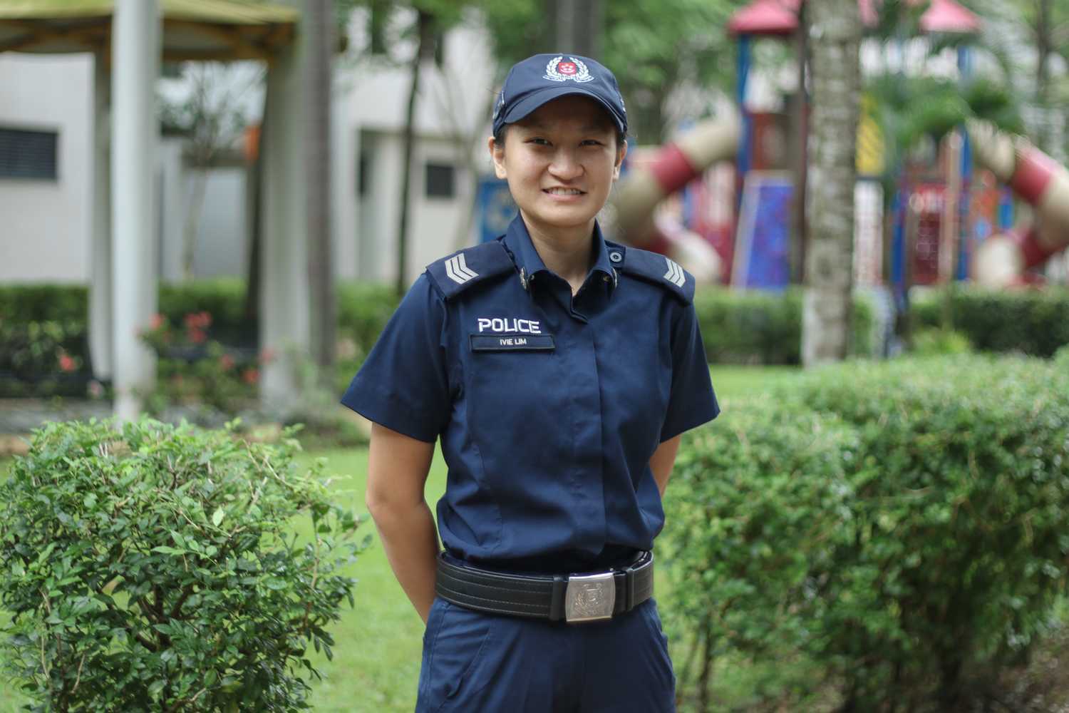Sergeant Ivie in her Ground Response Force patrol uniform (without operations kit), posing with her hands behind her back with a smile. 