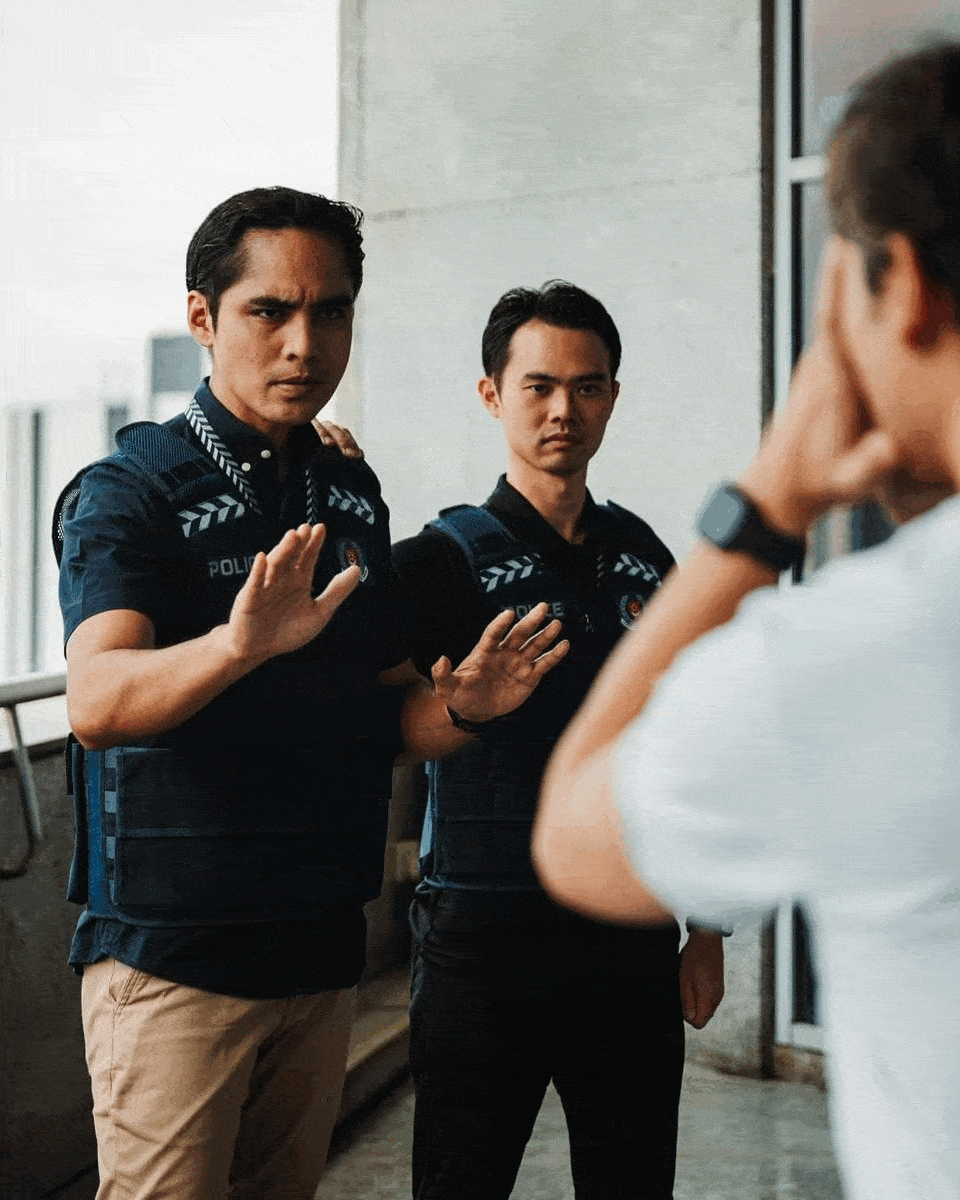 a gif images of two cnu officers talking to a subject and negotiating