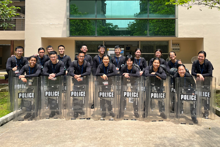 In a training photo taken during the high-intensity First Responder Training programme, ASP Chua and ASP Ang are looking straight at the camera with their teammates in gear.