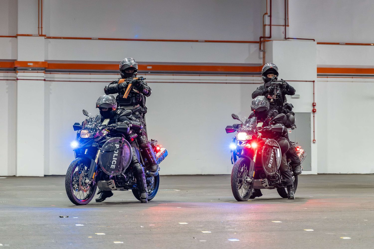 and indoor photo of two RDT bikes with each carrying two officers on each bike