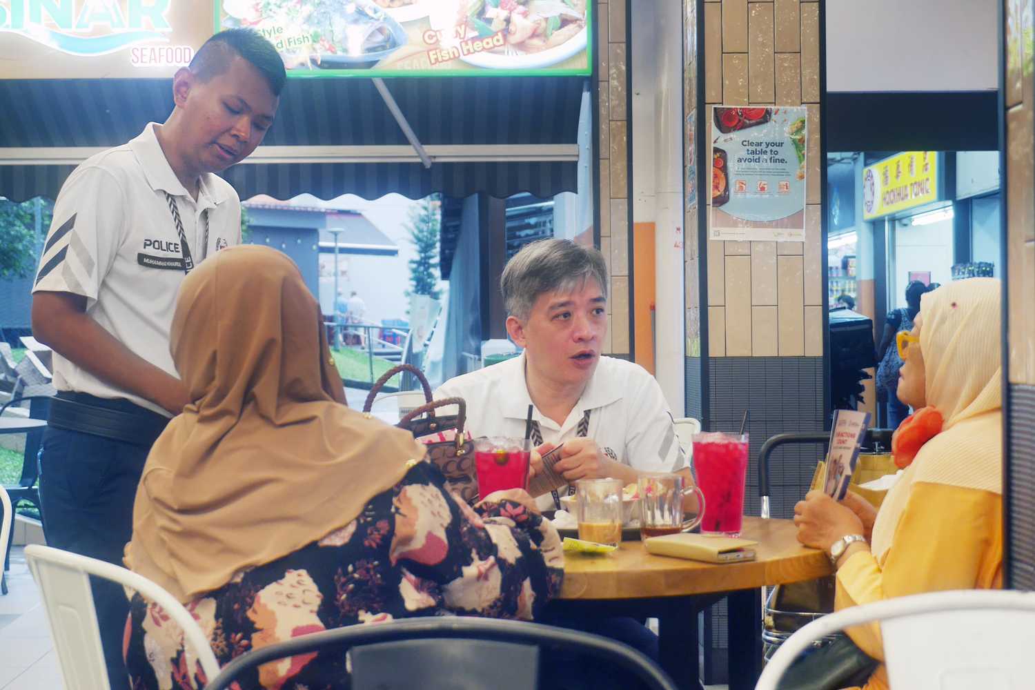 Officers sharing the latest advisories and crime trends with residents.