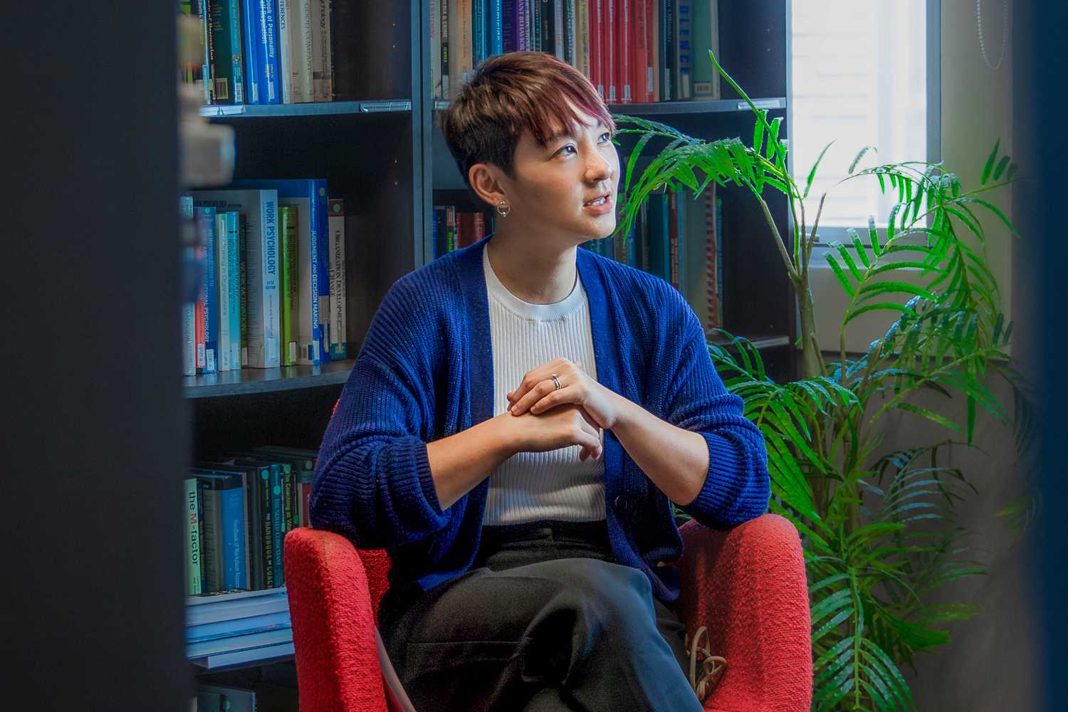 Ms Khoo Yan Leen, a Police Psychologist and the Assistant Director of the Organisational and Personnel Psychology Division, sits on a chair and appears to be deep in thought. She is recounting her experiences and how positive reinforcements from the officers that she works with keep her going.