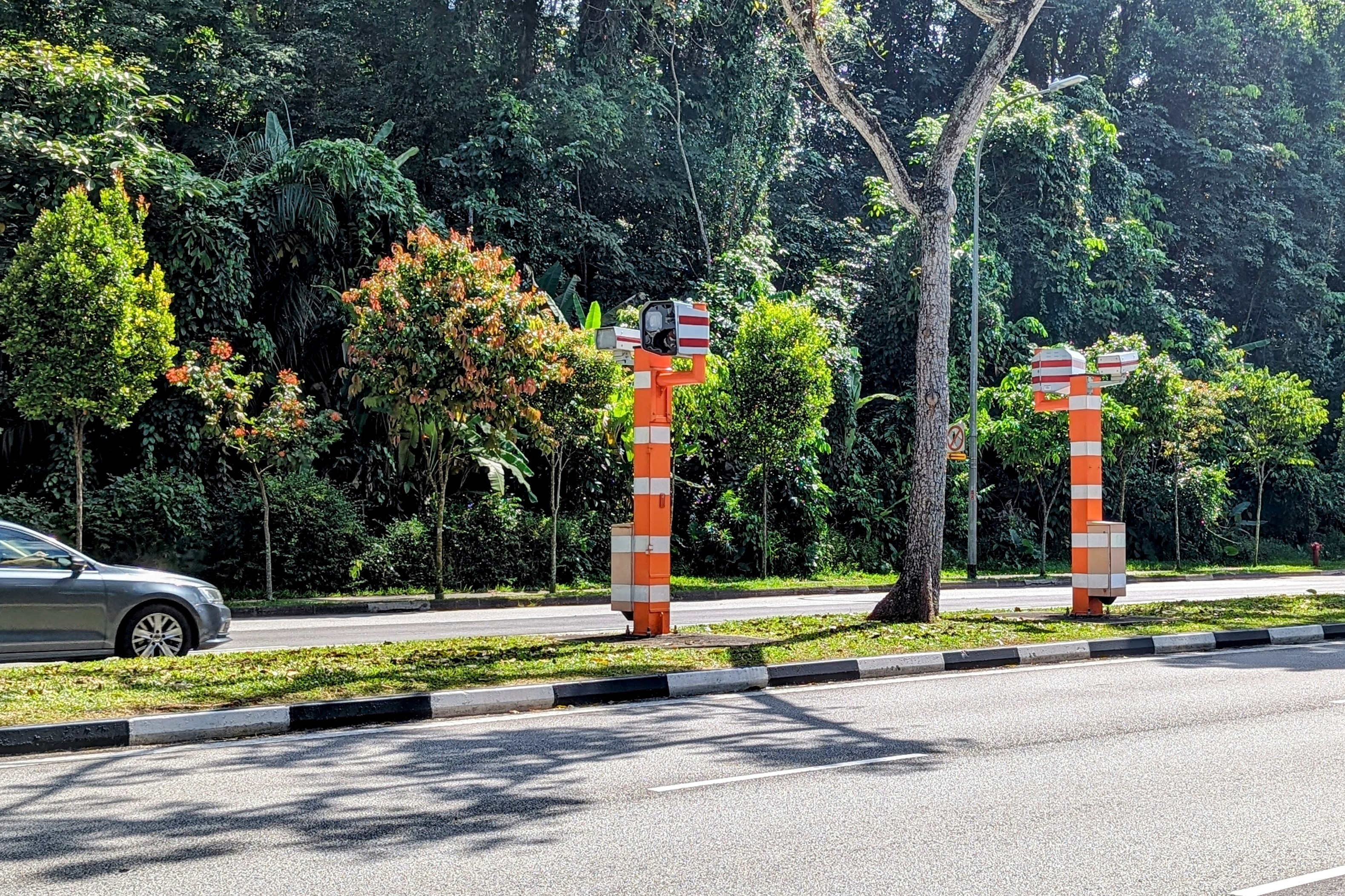 Traffic Police cameras capturing speeding vehicles from both directions of the roads