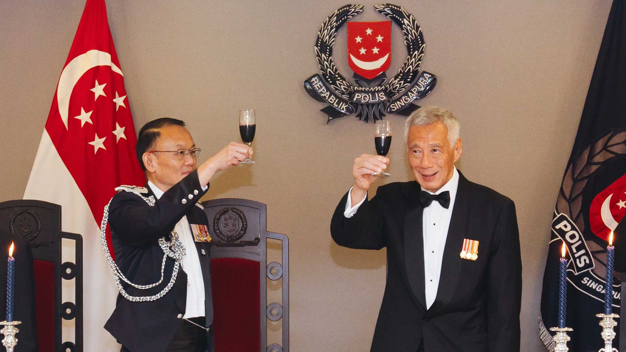 PM Lee Hsien Loong receiving a Loyal Toast from CP Hoong Wee Teck, officers and guests.