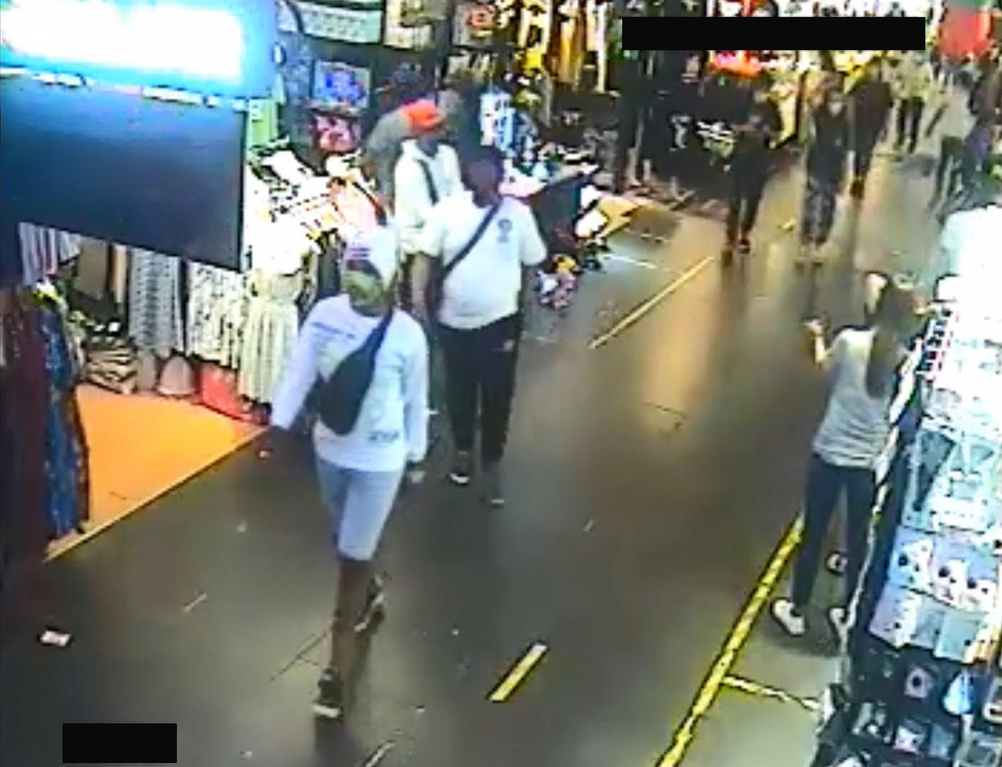 CCTV footage of the trio making purchases using the stolen funds. PHOTOS: SPF