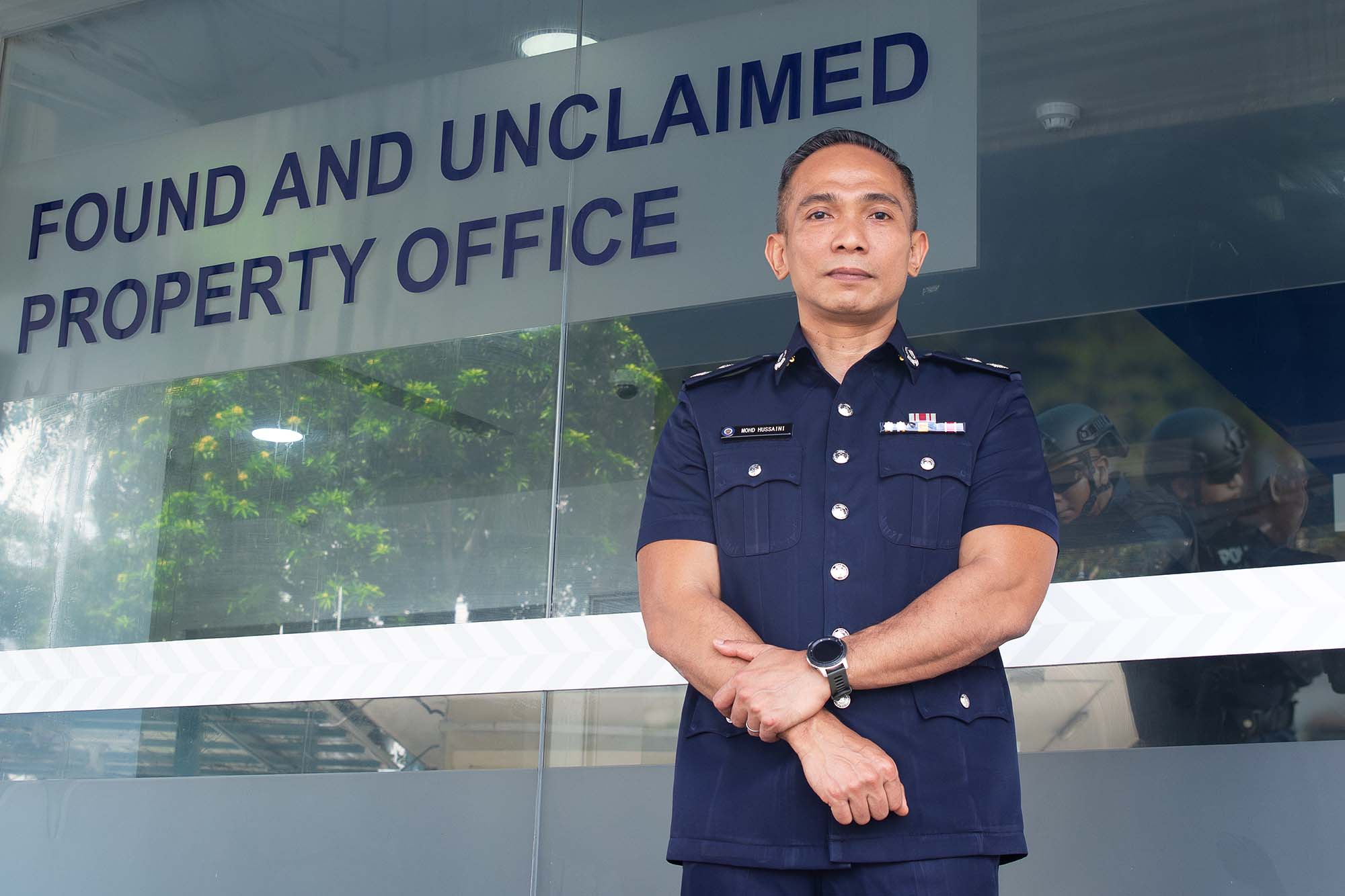 police officer standing infront of the fupo main office