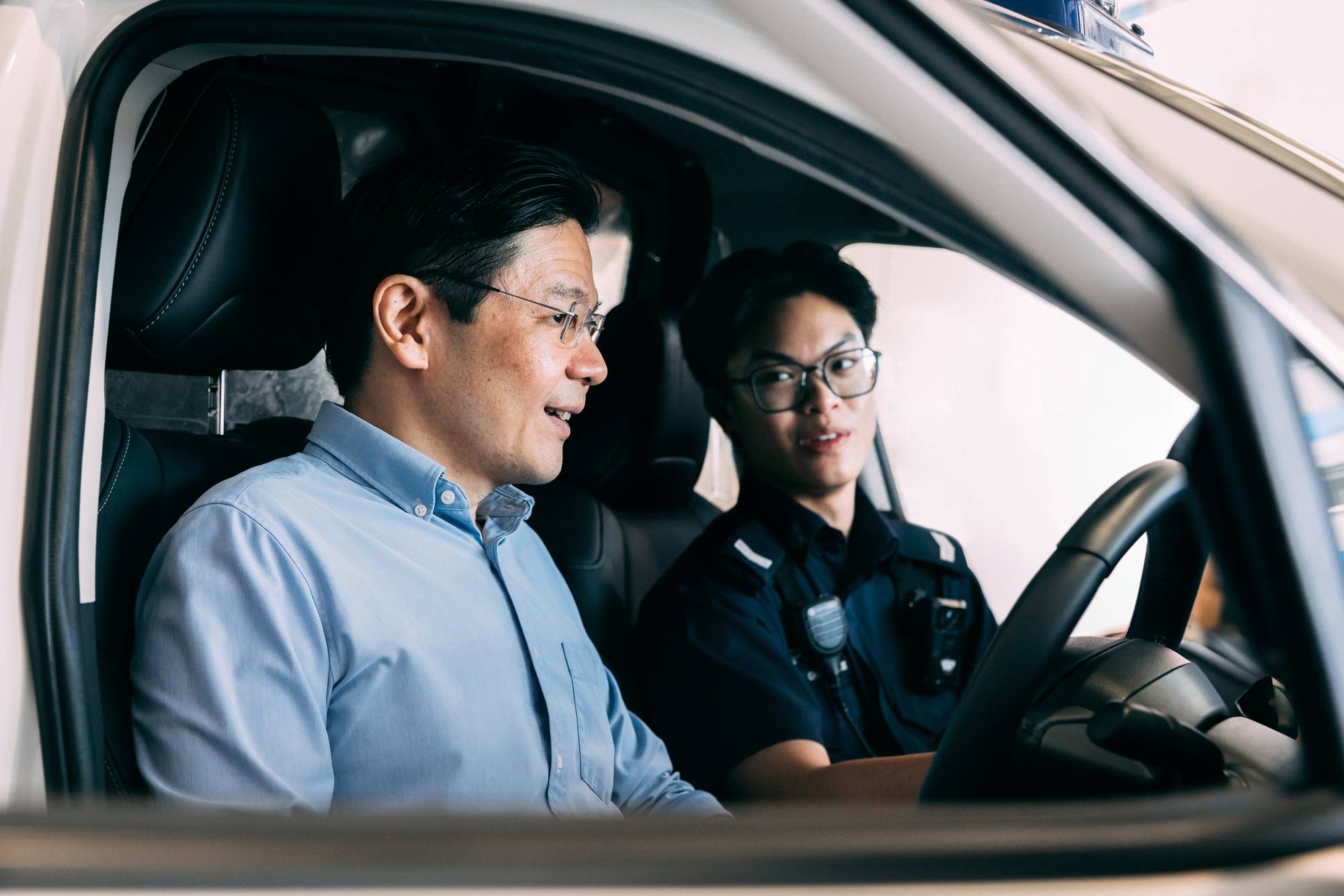 prime minister lawrence wong sitting in the NGFRC and being briefed by the NSF