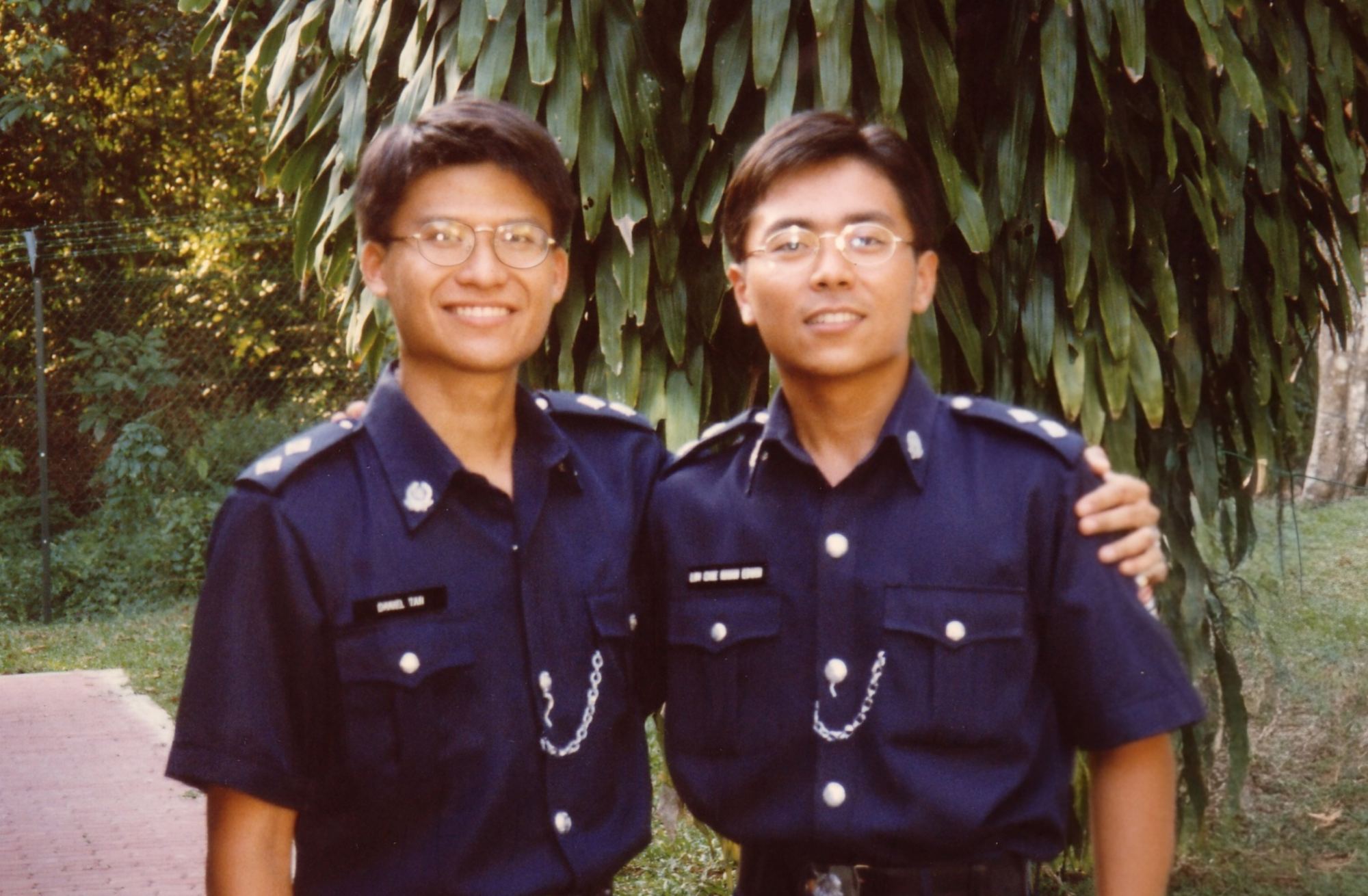 An old photo of two officers in old uniform with inspector ranks