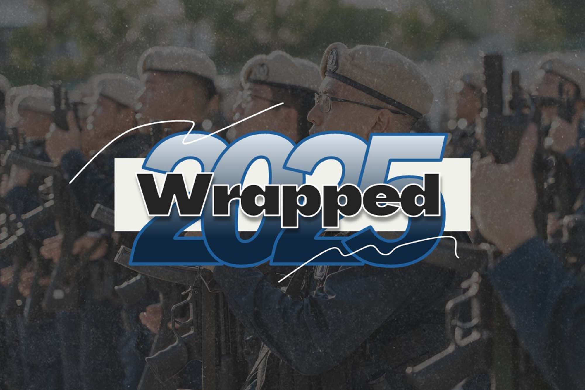 a photo of a designed word showing "2025" in blue and "Wrapped" in black, superimposed on a photo of officers in a sedentary position