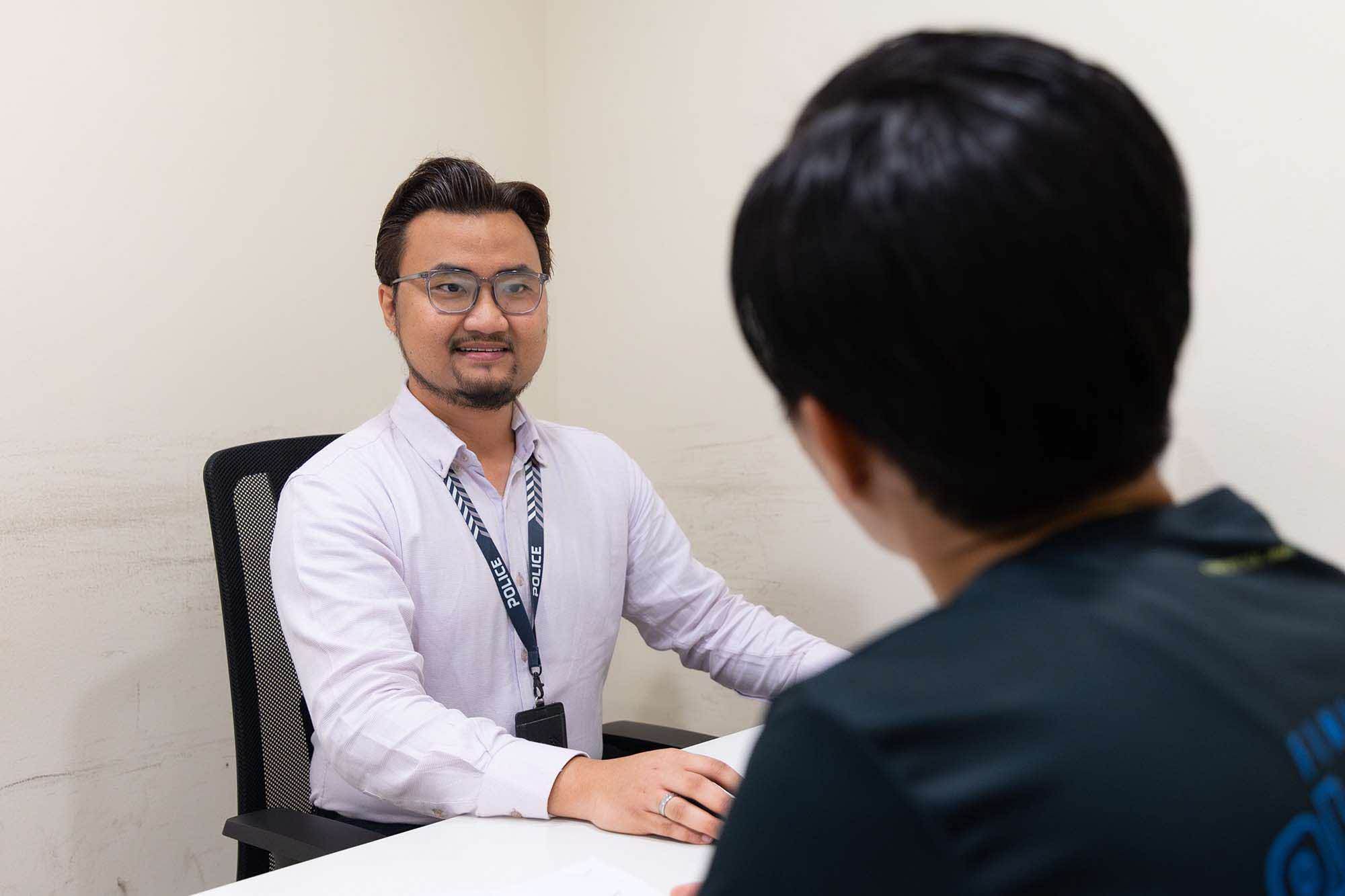 Mr Khairul attending to a licence applicant.