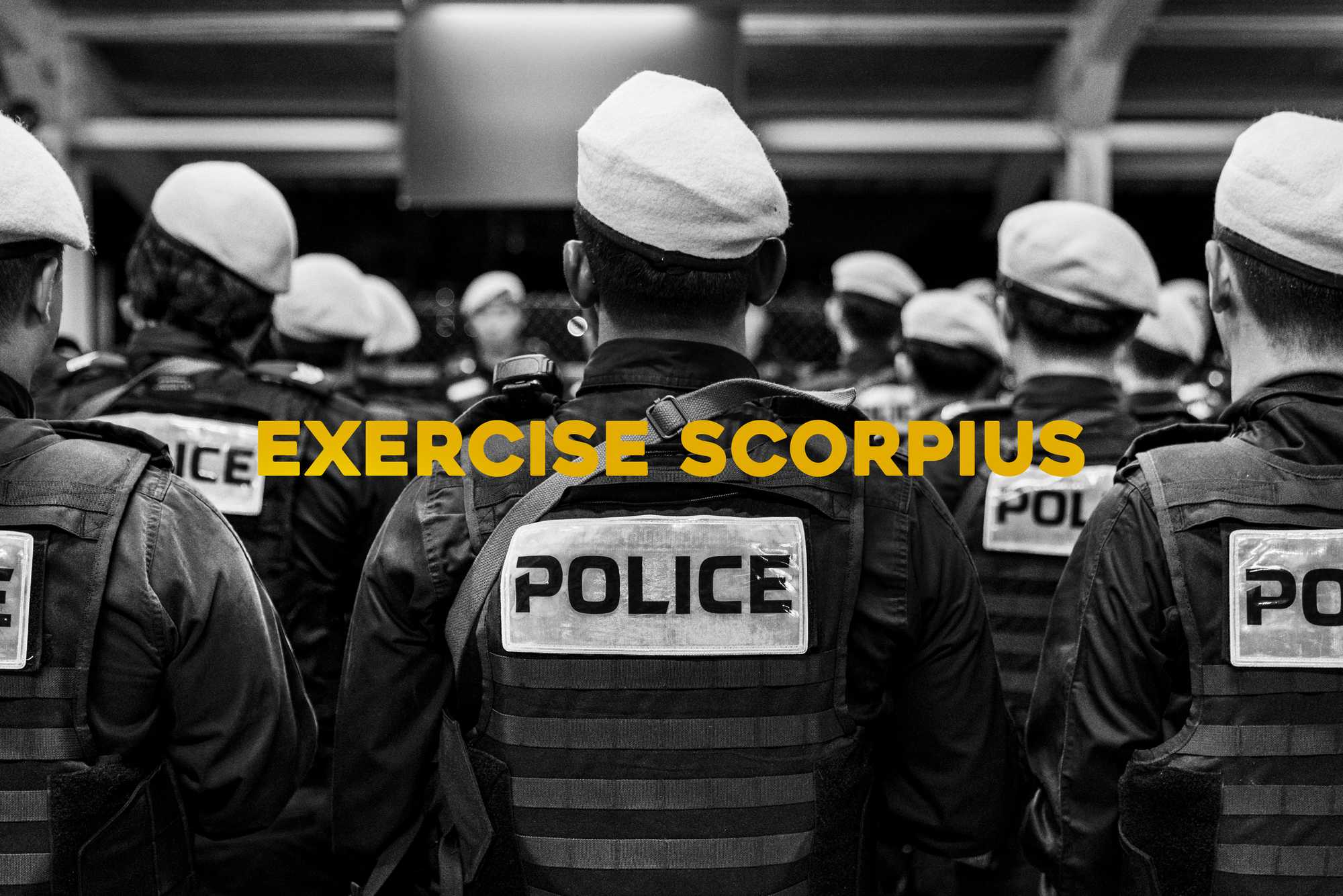 a black and white photo of procom officers facing forward and with a yellow text saying exercise scorpius in the middle