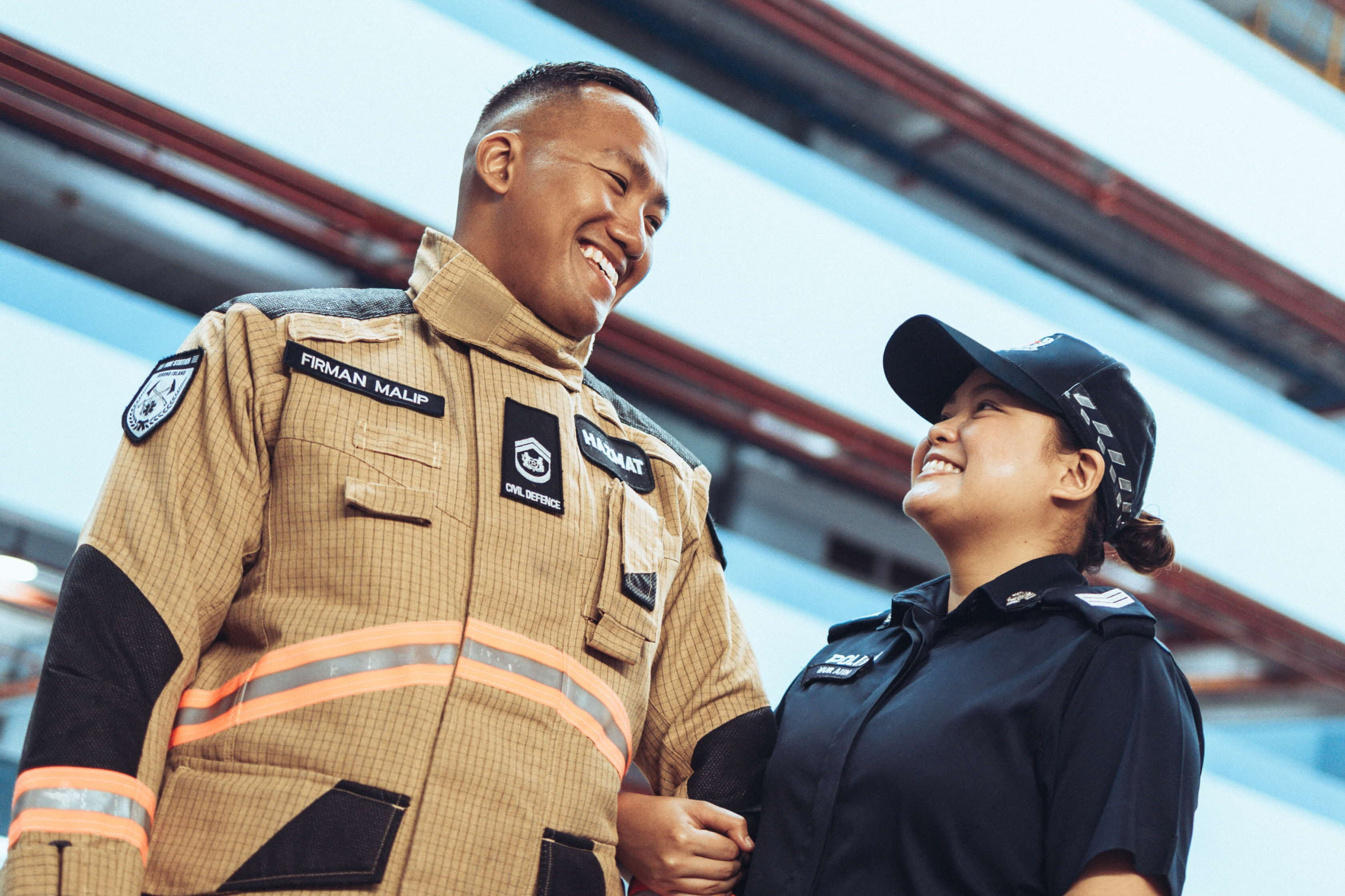Sgt Aiin holding WO Firman's arm in uniform