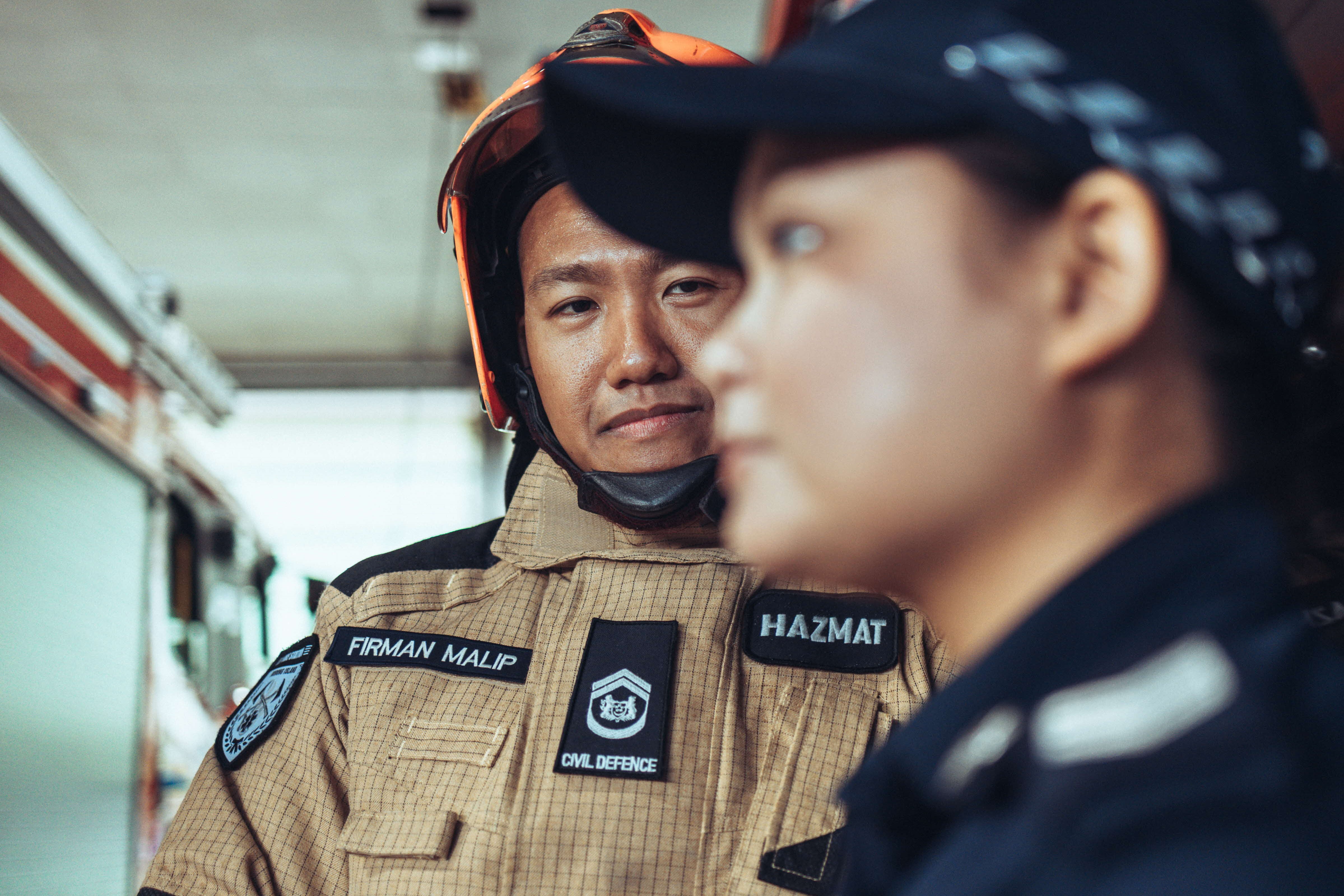 WO Firman looking at Sgt Aiin in full uniform