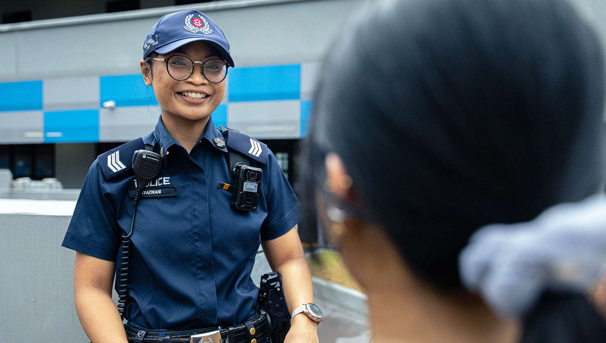 Sgt Syazwani interacting with a member of the public.