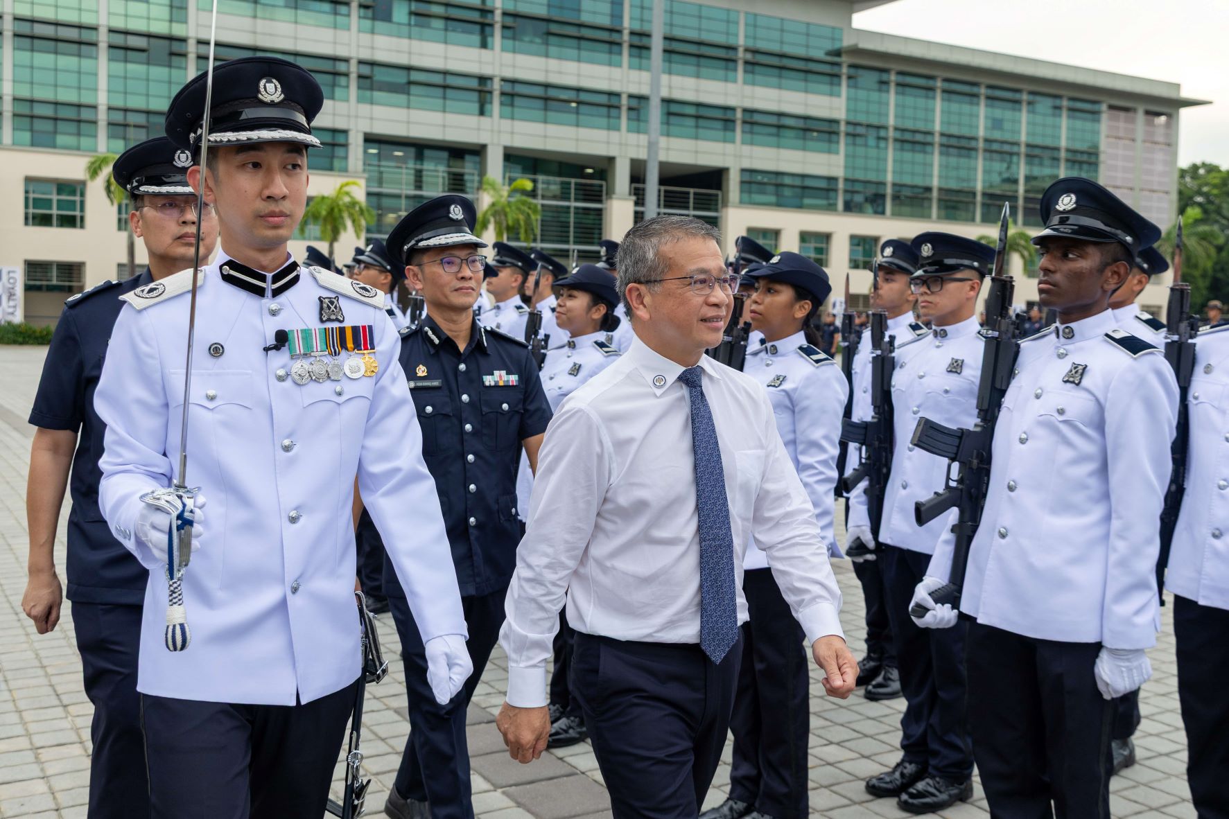 Minister Edwin Tong reviewing the Guard of Honour Contingent.