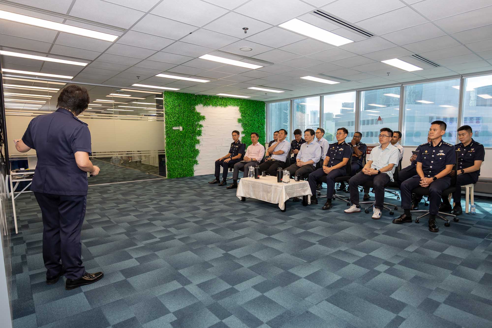 AC Yap giving a presentation on the scams and cybercrime situation in Singapore. 