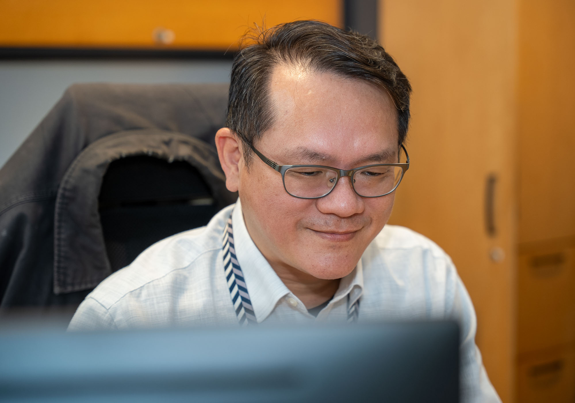 SAC Tan Tin Wee working in his office. 