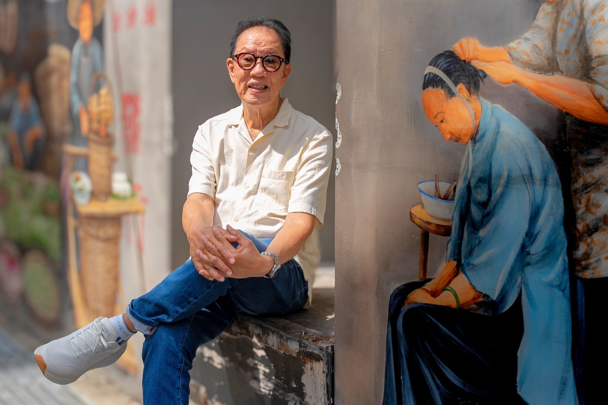 Mr Clement Mesenas posing at a street in Chinatown. 