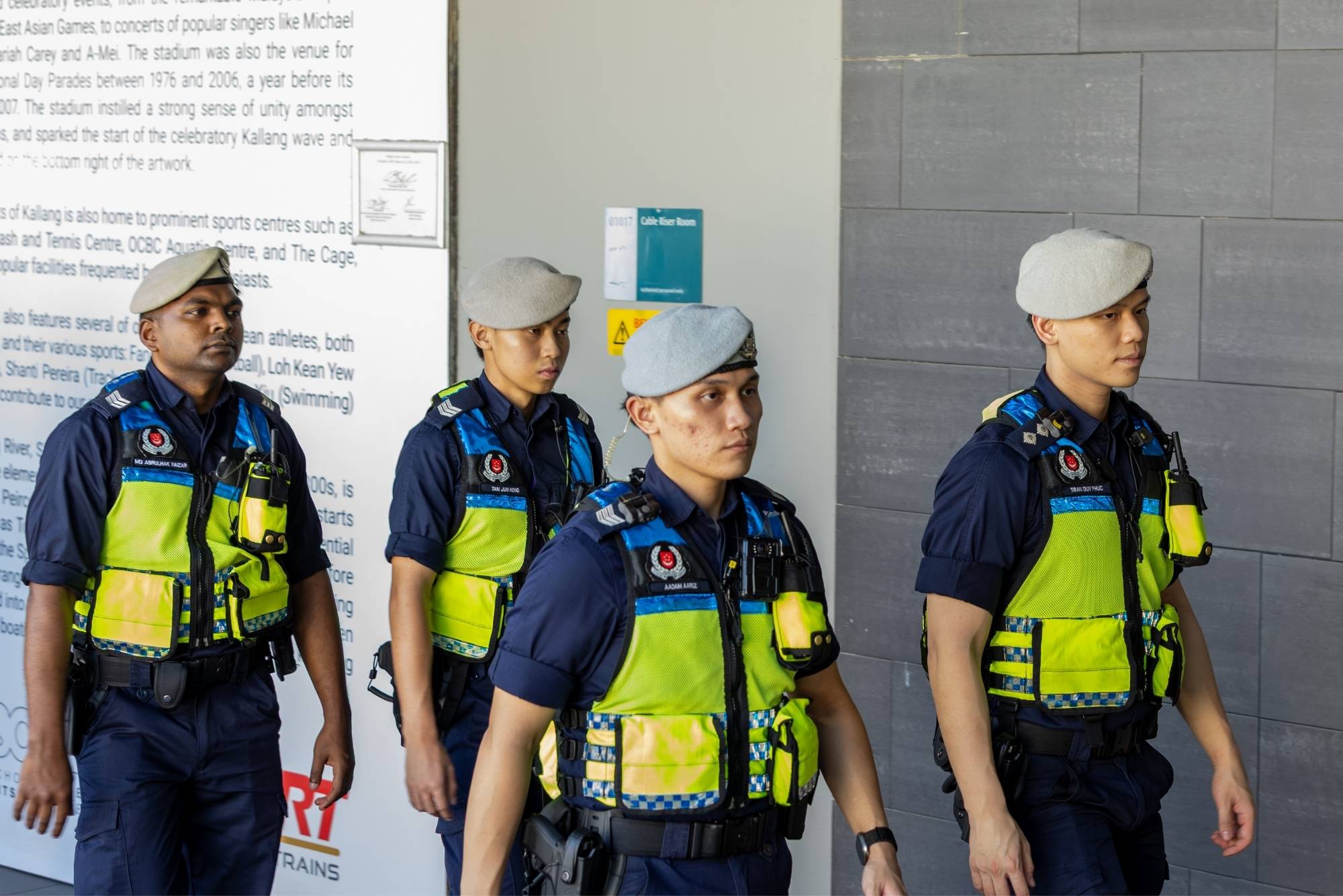 Public Transport Security Command officers on patrol and carrying out crowd control duties around Stadium MRT Station. 