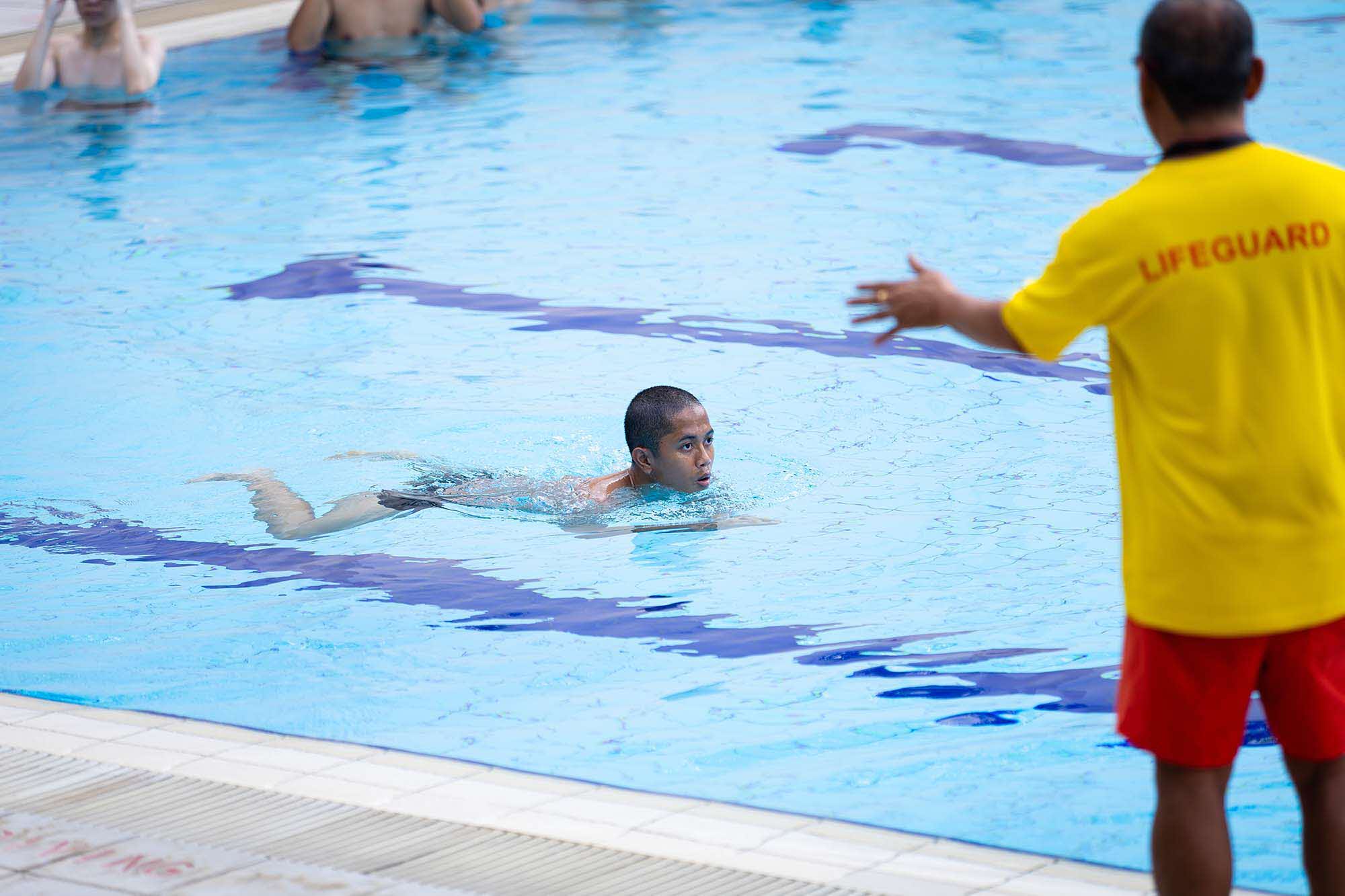 First swimming lesson, with trainees brushing up on their breast-stroke technique.