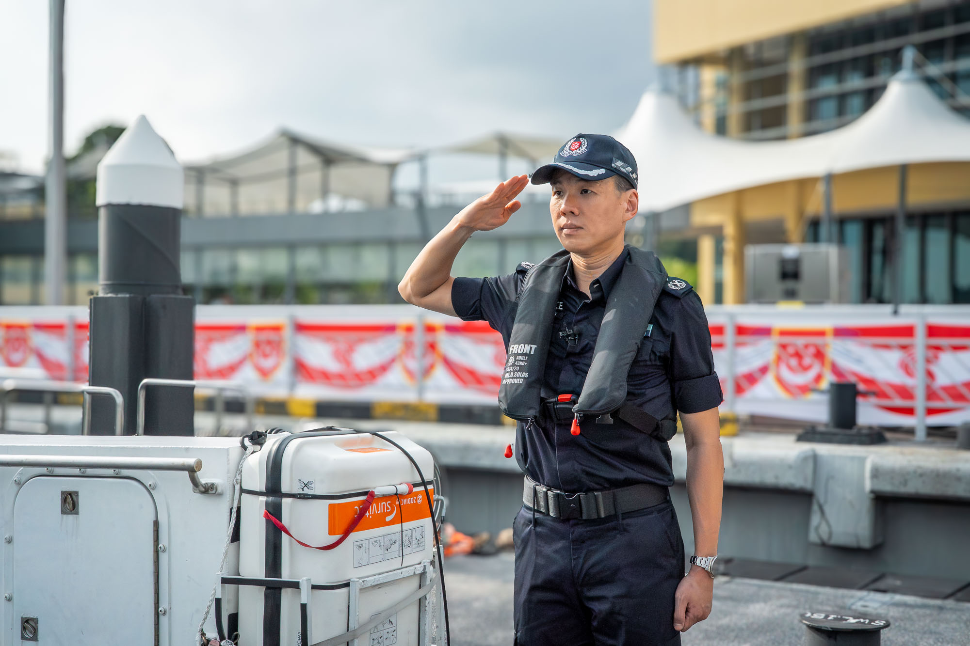 SAC Ang saluting his officers.