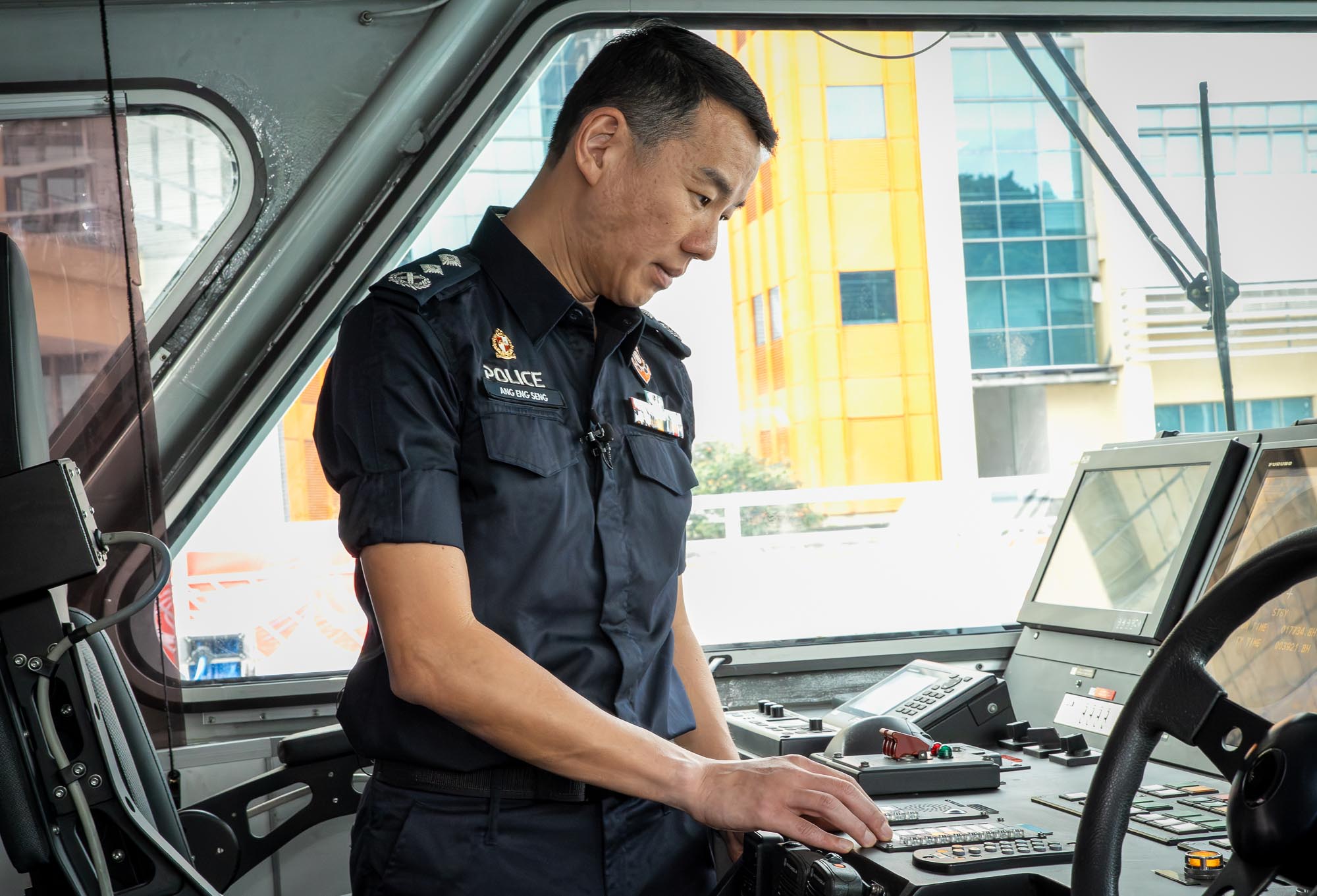 SAC Ang looking at controls inside a PCG vessel. 