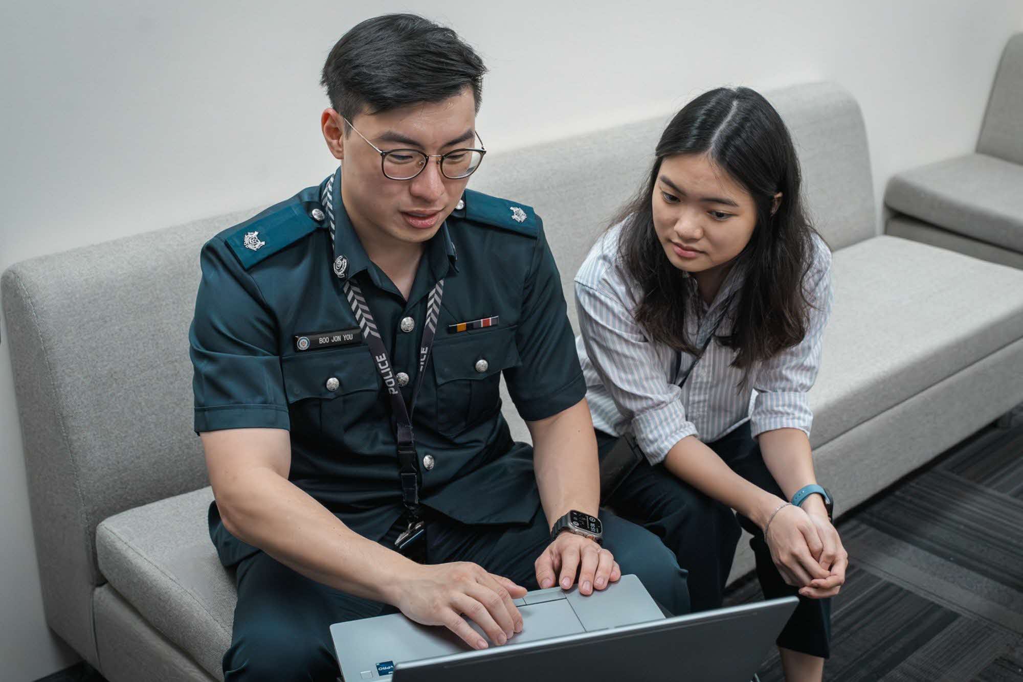 ASP Boo Jon You and Ms Chloe Chua working together in their office.