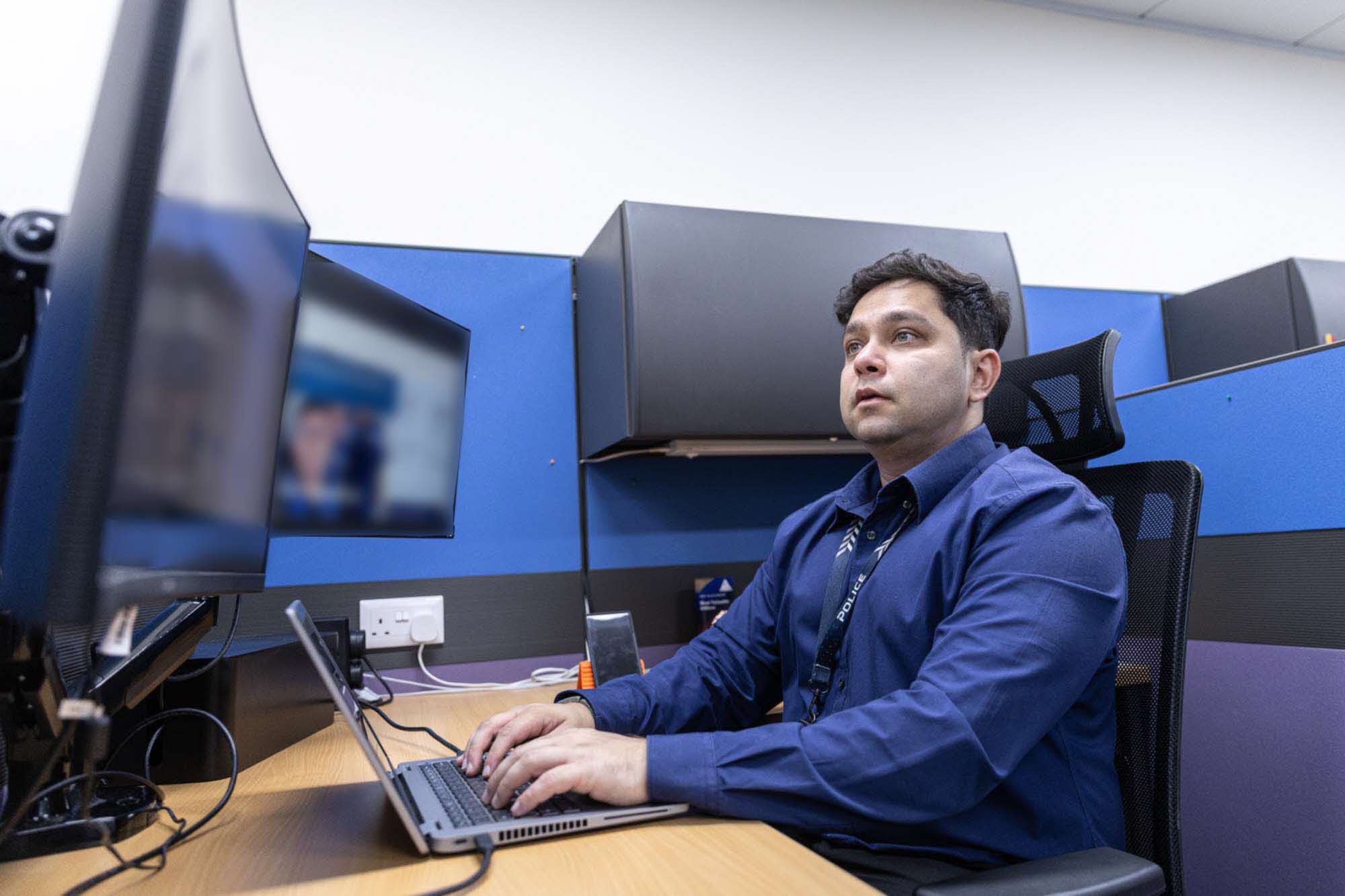 ASP Mohamed Shariff working at his desk.