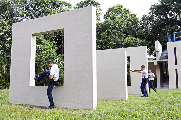 police trainees undergoing obstacle course