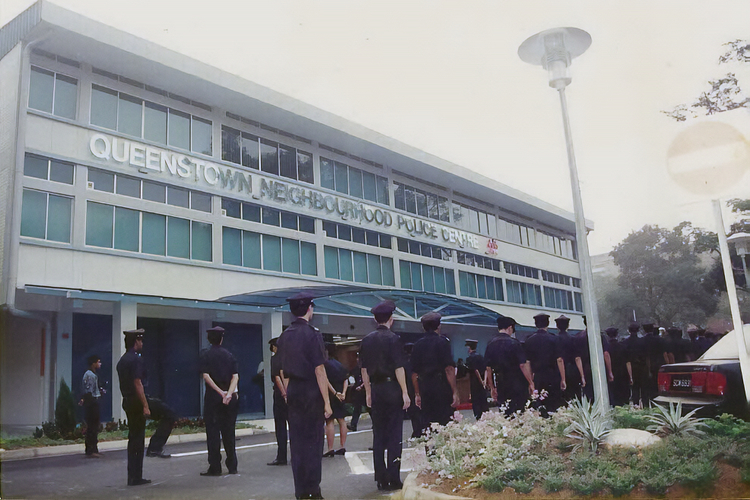 police officers having an inspection infront of the old queenstown npc building