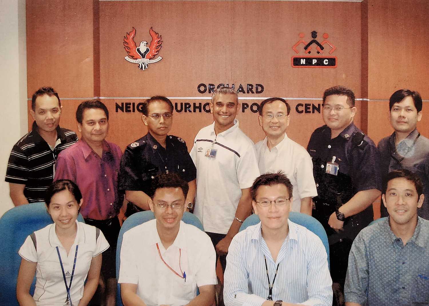 group of orchard npc pioneers inside a meeting with the orchard npc house colours in the background