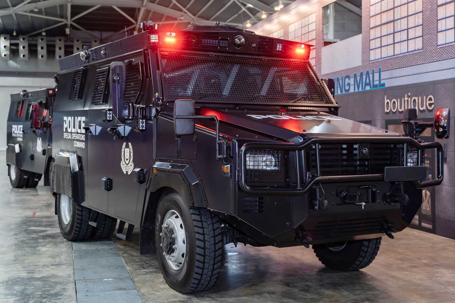 image of the police tactical strike vehicle. The vehicle is black in colour with the words "special operations command" written on the side of the vehicle in white. 
