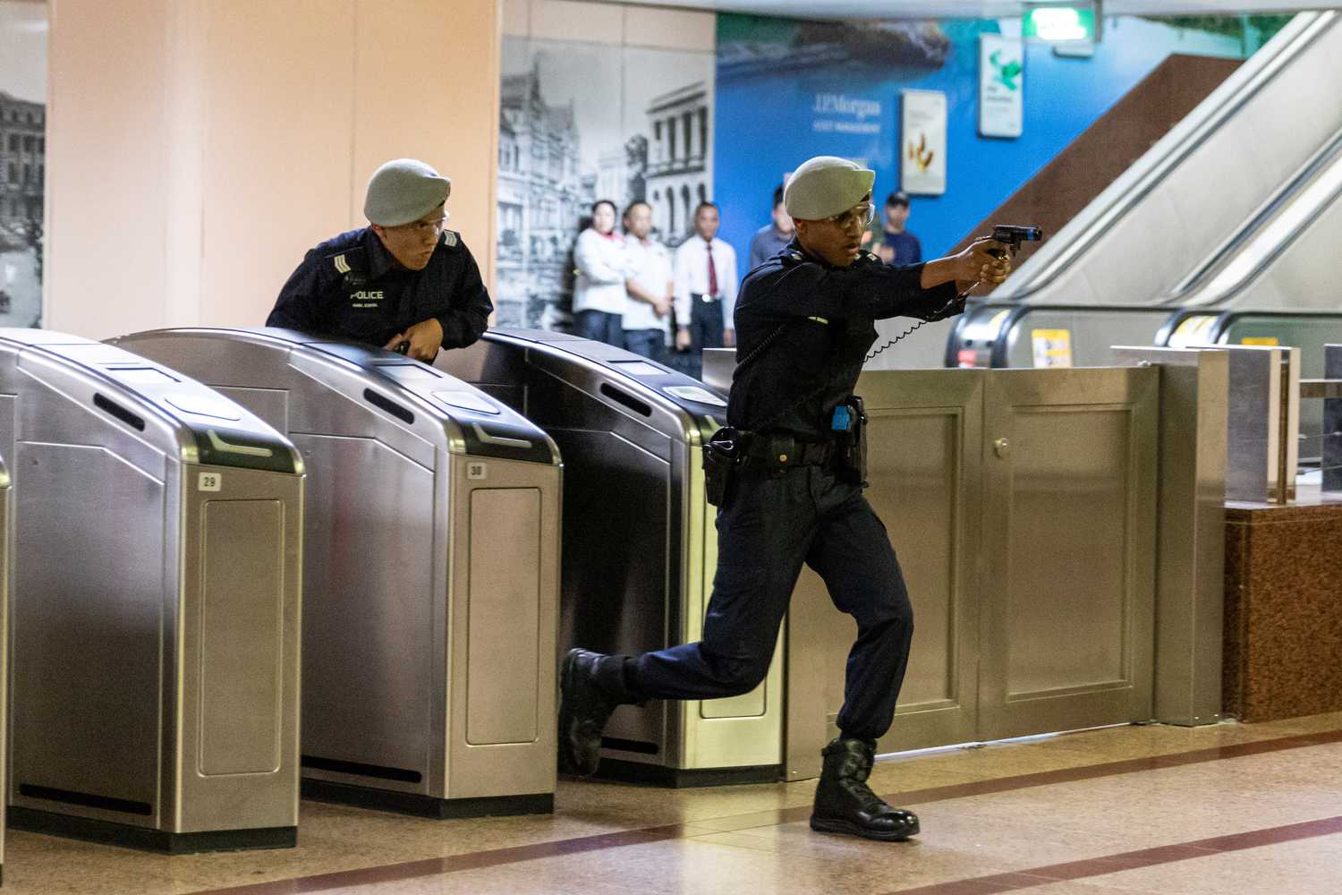 transcom officers dashing through the gantry with their guns pointed up