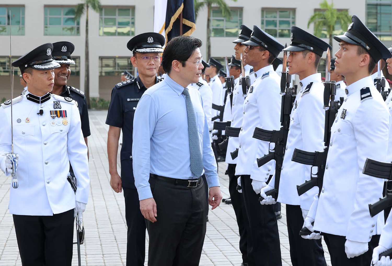 DPM Lawrence Wong inspecting the Guard of Honour contingent 