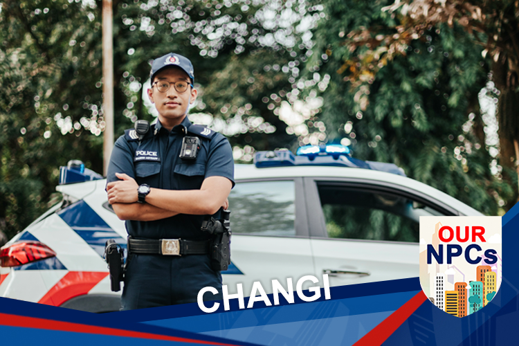 Police Officer standing infront of a police car, with his arms crossed