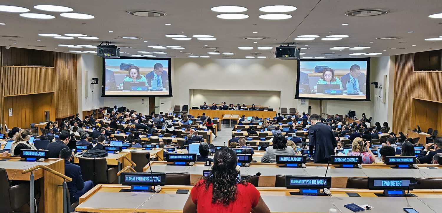 many people in an assembly hall that is holding a conference 