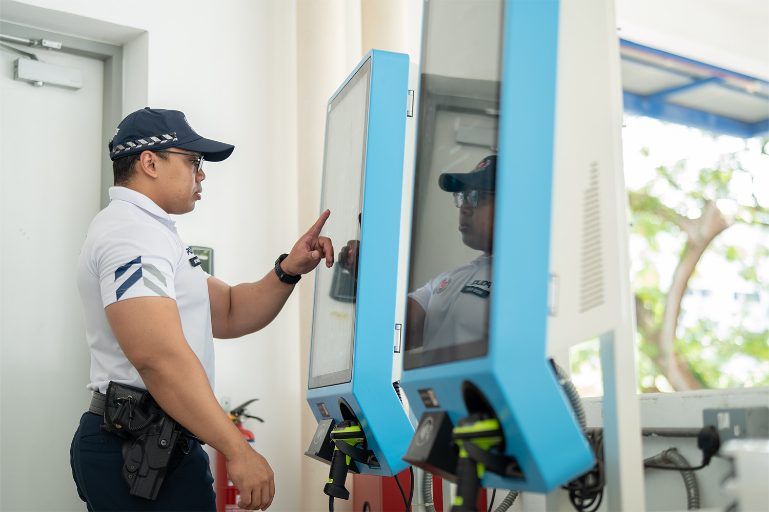 cpu officer pressing a button on the interactive display of the AES