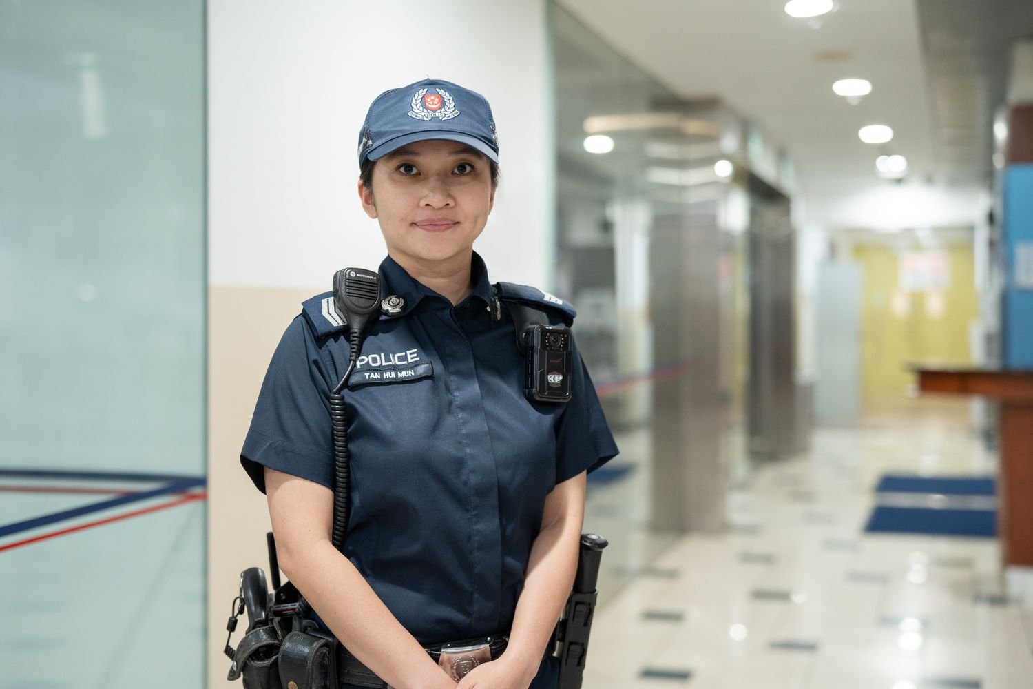 female police officer standing at the police station lobby