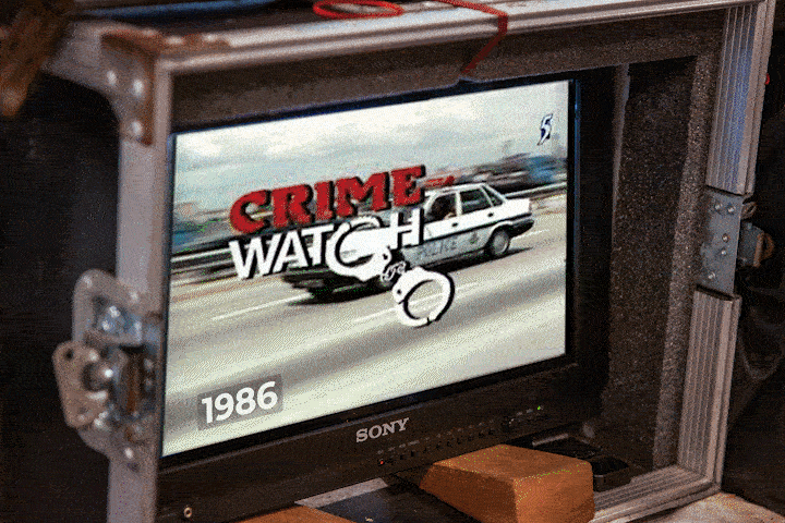 A GIF of an old computer with a 'SONY' label featuring moving logos of 'Crimewatch' in different designs. 