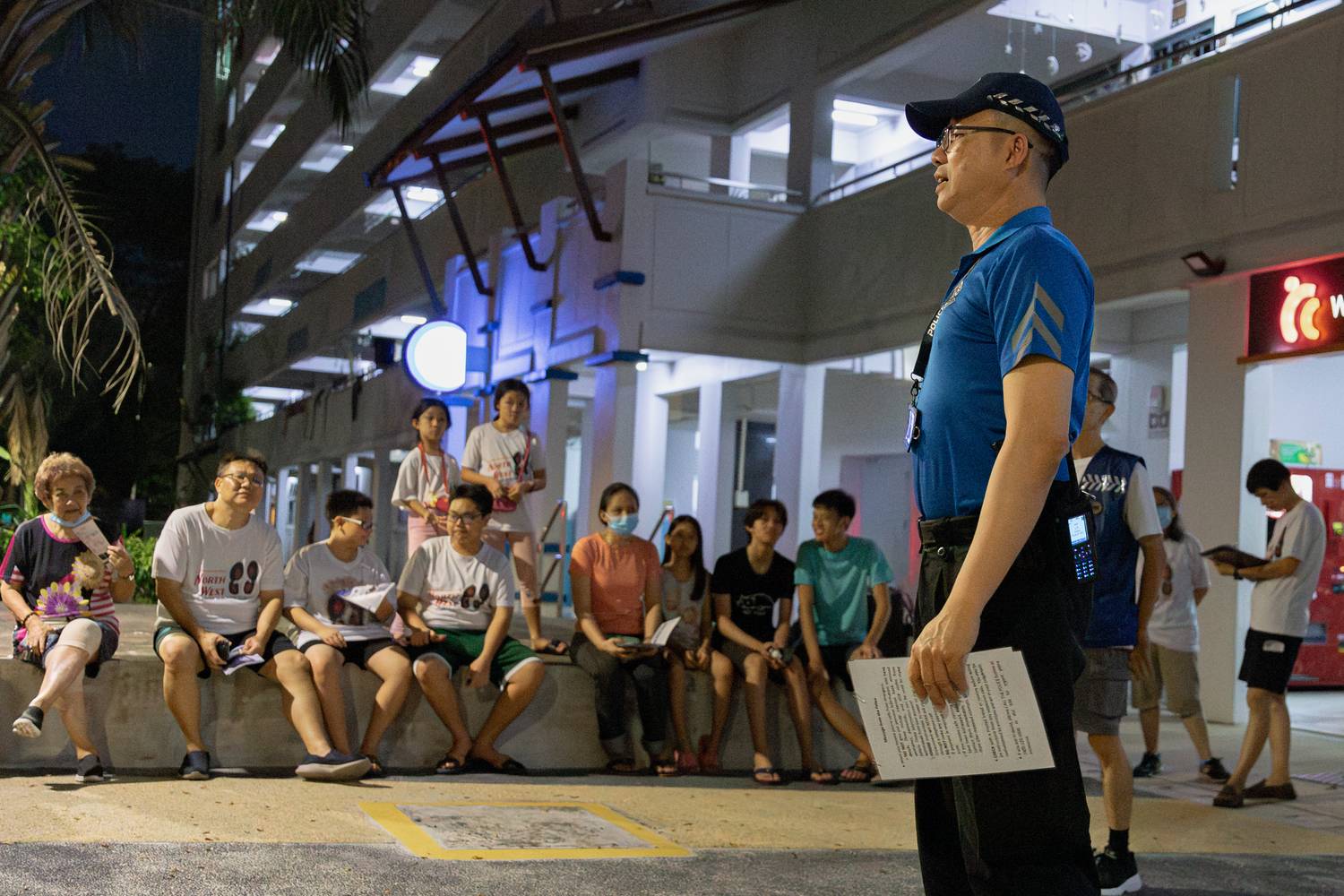 VSCC ming yu standing and talking to the residents