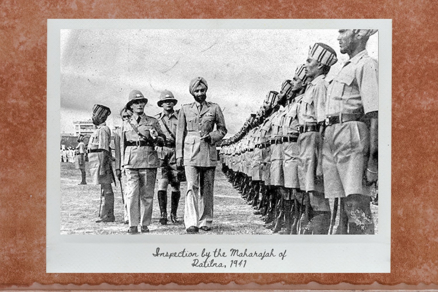 british officers escorting a guard of honour to inspect a group of sikh officers standing at attention