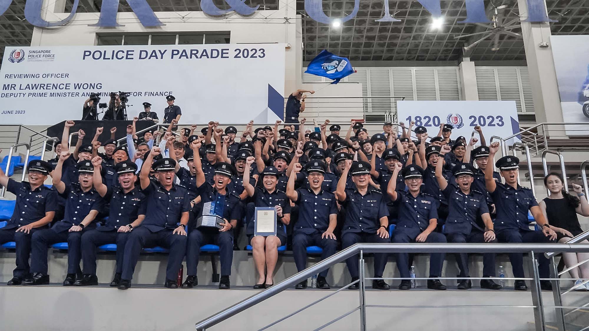 AC Chiu (first row, sixth from the left) led Clementi Police Division to win the Best Land Division award at Police Day Parade 2023. PHOTO: SPF